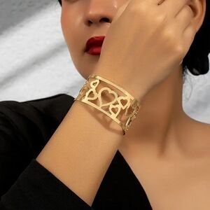 Gold Heart Cuff Bracelet with Intricate Cut-Outs